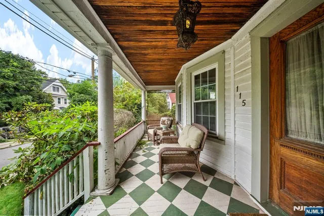 a balcony with chairs and outdoor views