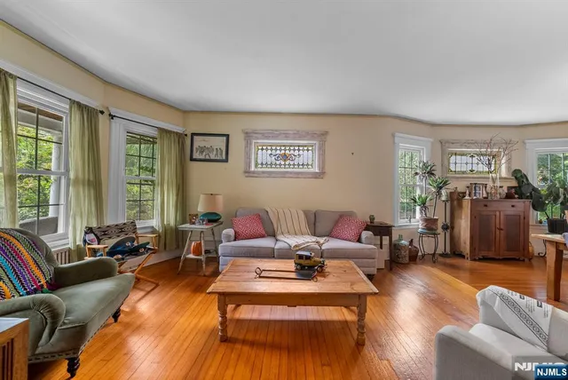 a living room with furniture or couch and a large window