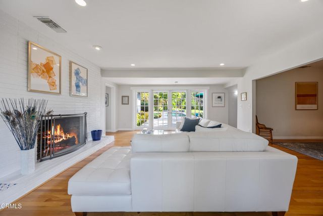 a large bedroom with a large bed and a large window