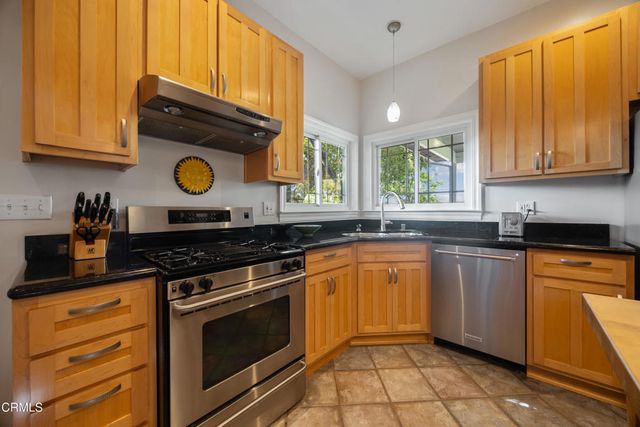 a spacious bedroom with a bed and wooden floor