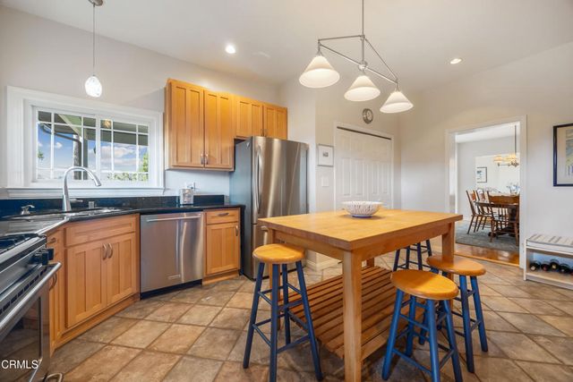a spacious bedroom with a bed and wooden floor