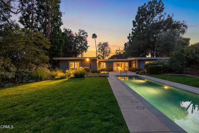 front view of a house with a garden
