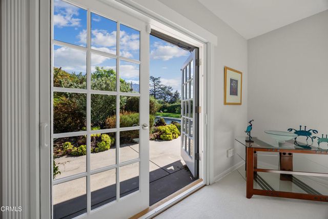 a view of a park with large trees