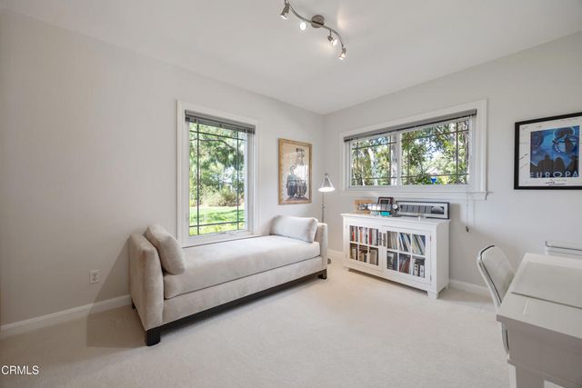 a view of a backyard with sitting area