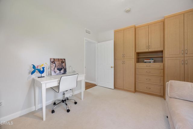 a front view of a house with yard patio and green space