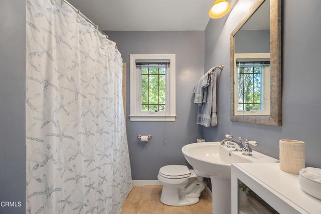 a view of a garden with a building in the background