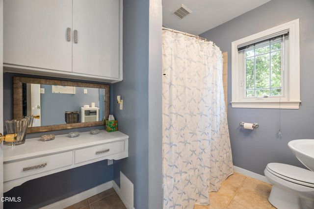 a backyard of a house with lots of green space and garden view