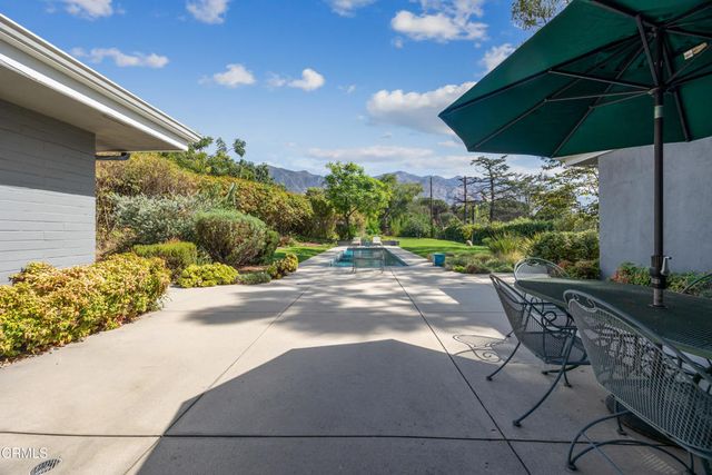 an aerial view of a house with outdoor space