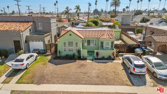 a aerial view of a house with swimming pool