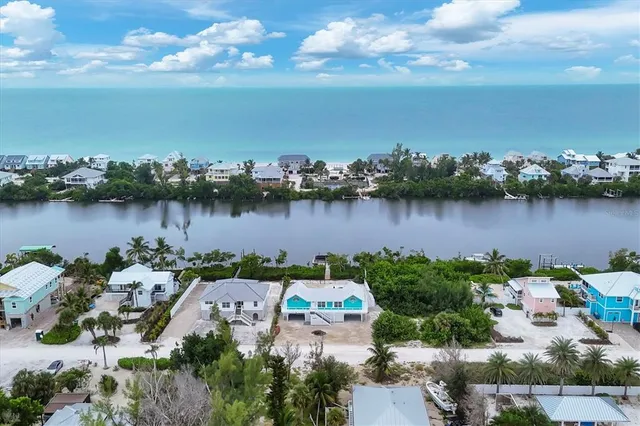 an aerial view of a house with a lake view and a lake view