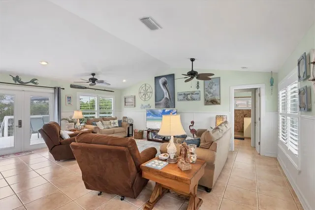 a living room with fireplace furniture and a wooden floor
