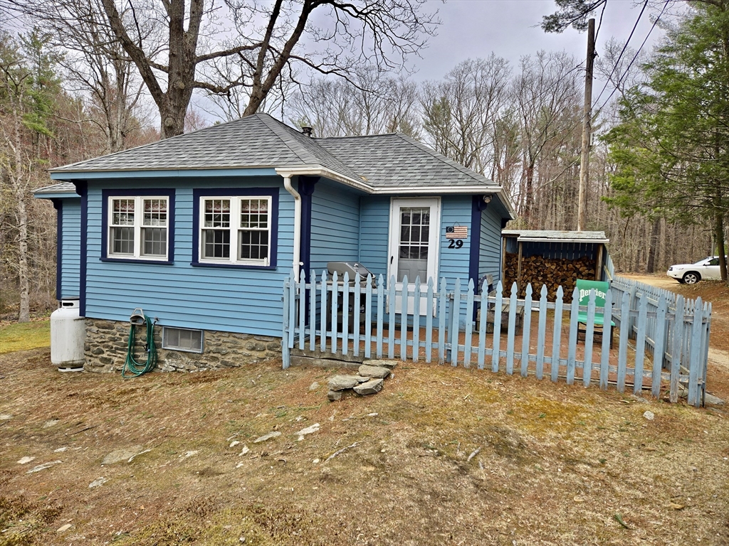a front view of a house with a fence