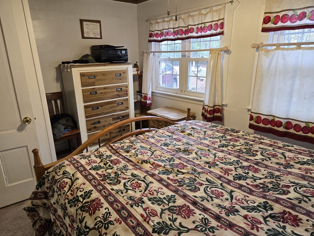 29 Finn Park Road Rutland, MA 01543 - Photo 11 of 24 a bed sitting in a bedroom next to a window