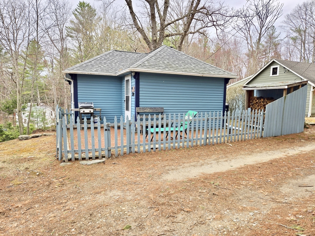 29 Finn Park Road Rutland, MA 01543 - Photo 2 of 24 a view of a house with wooden fence and a large tree