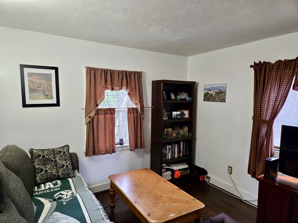 29 Finn Park Road Rutland, MA 01543 - Photo 5 of 24 a living room with furniture a bookshelf and a window