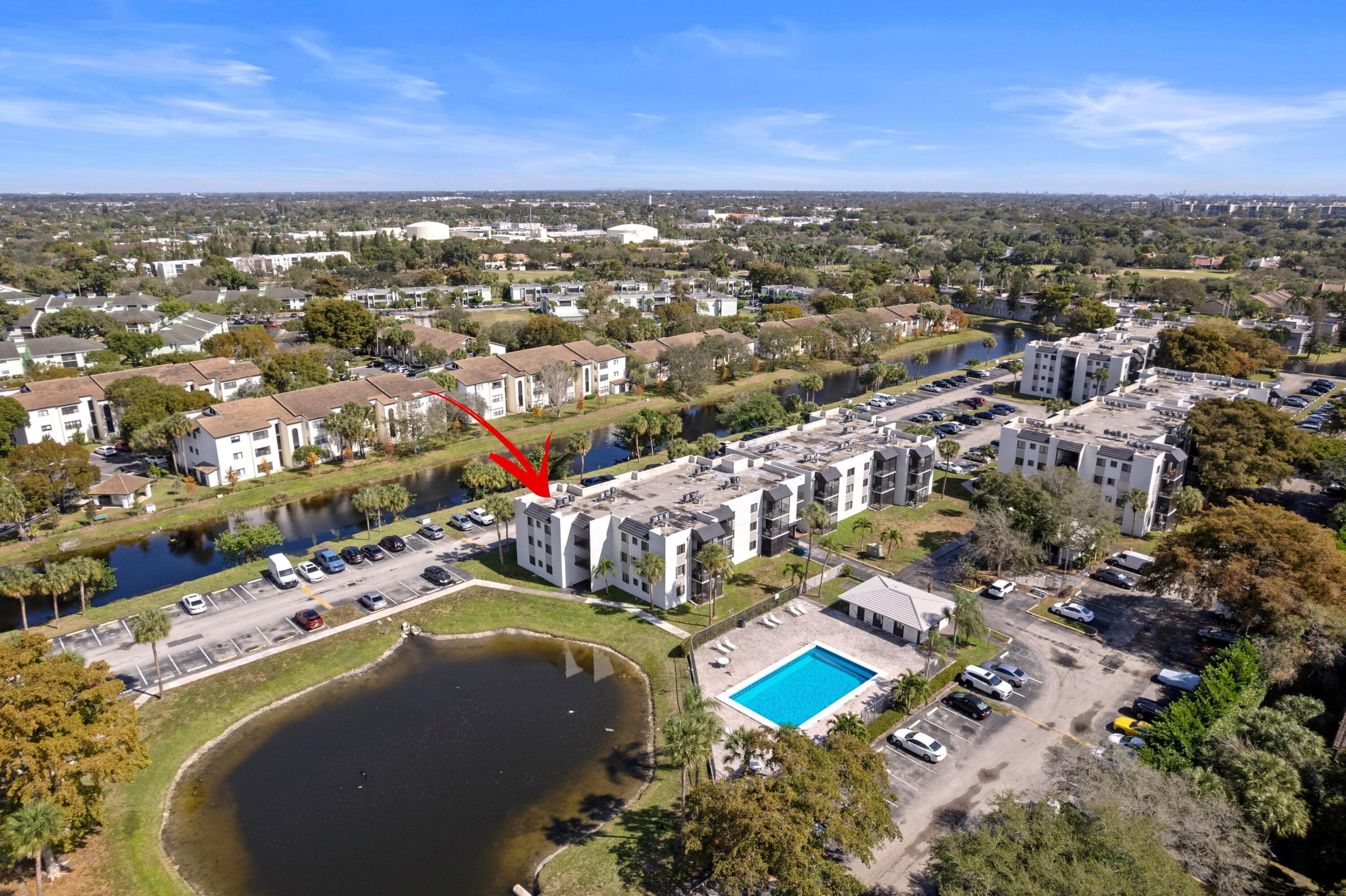 3710 North Pine Island Road, Unit 114 Sunrise, FL 33351 - Photo 1 of 32 an aerial view of residential houses with outdoor space