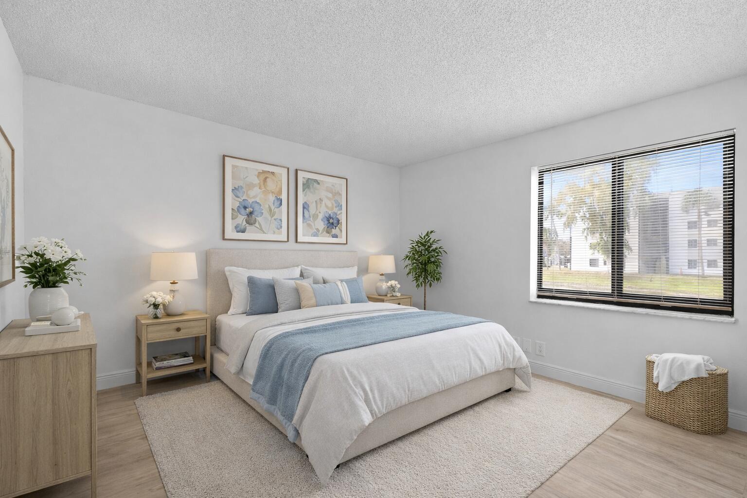 3710 North Pine Island Road, Unit 114 Sunrise, FL 33351 - Photo 11 of 32 a bedroom with a large bed and a window
