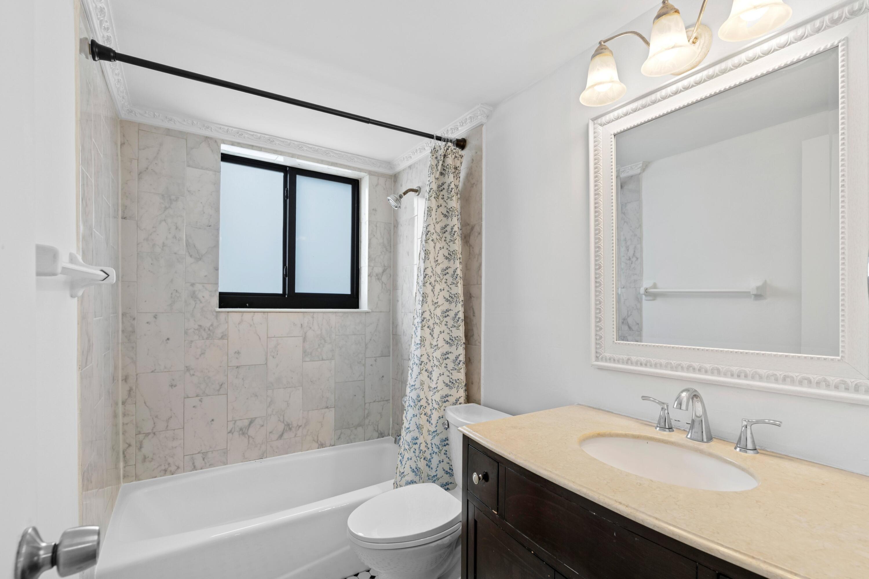3710 North Pine Island Road, Unit 114 Sunrise, FL 33351 - Photo 12 of 32 a bathroom with a sink a toilet and shower