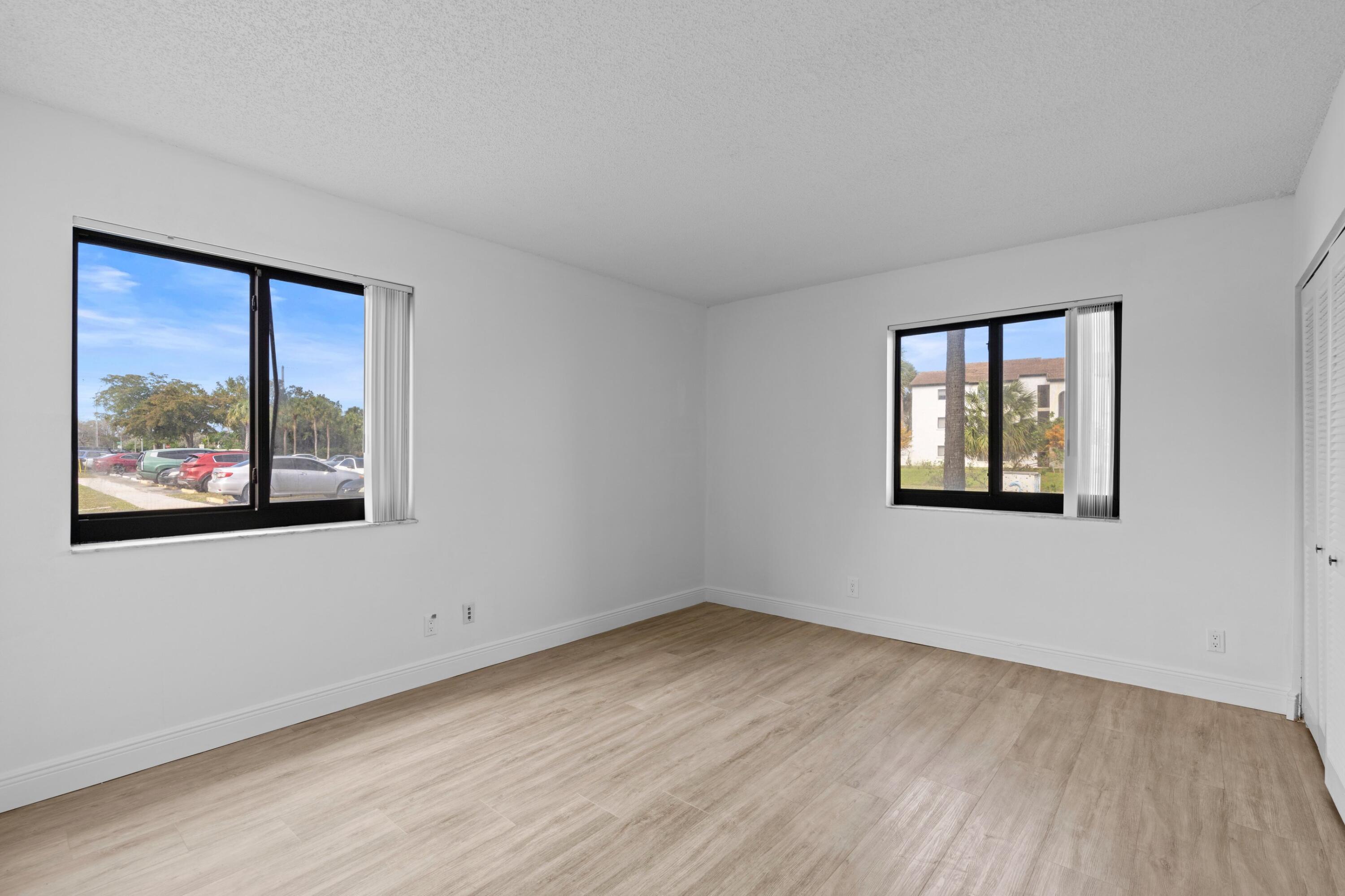 3710 North Pine Island Road, Unit 114 Sunrise, FL 33351 - Photo 13 of 32 an empty room with windows