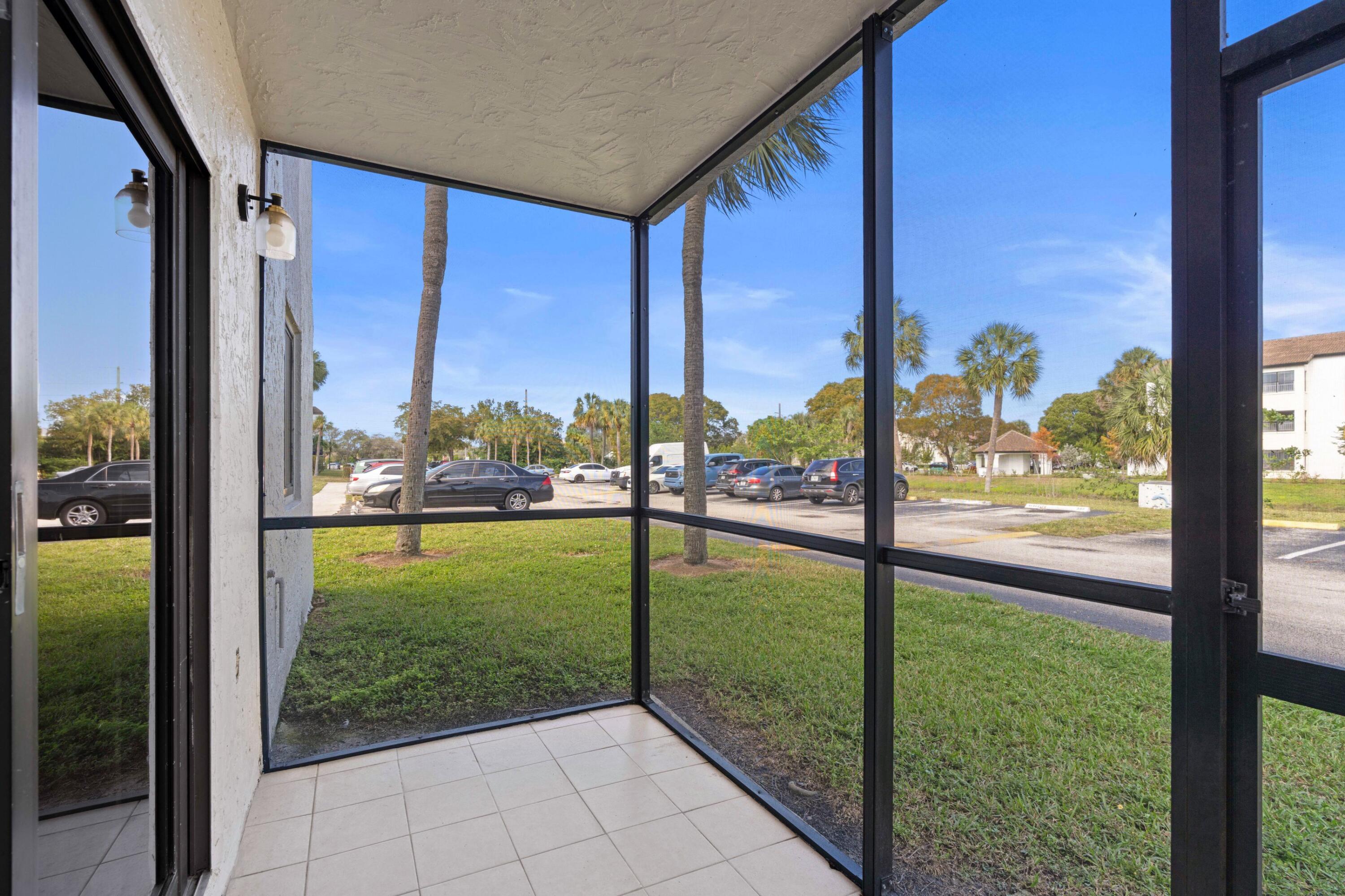 3710 North Pine Island Road, Unit 114 Sunrise, FL 33351 - Photo 14 of 32 a view of backyard from window