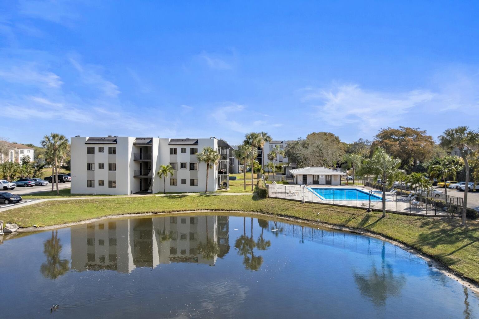 3710 North Pine Island Road, Unit 114 Sunrise, FL 33351 - Photo 16 of 32 a view of a swimming pool with an outdoor seating