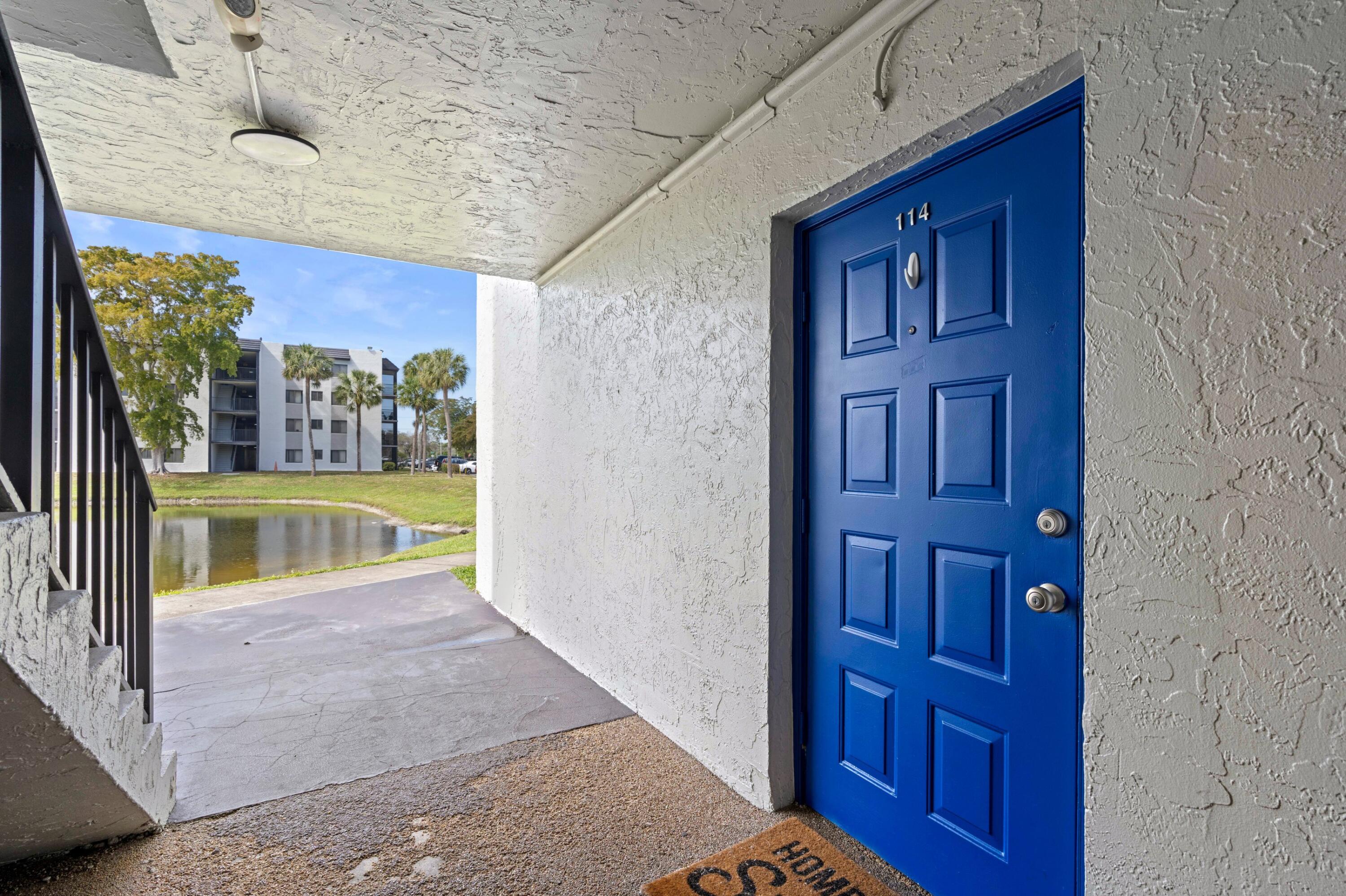 3710 North Pine Island Road, Unit 114 Sunrise, FL 33351 - Photo 17 of 32 a view of a hallway with a dining table and chairs