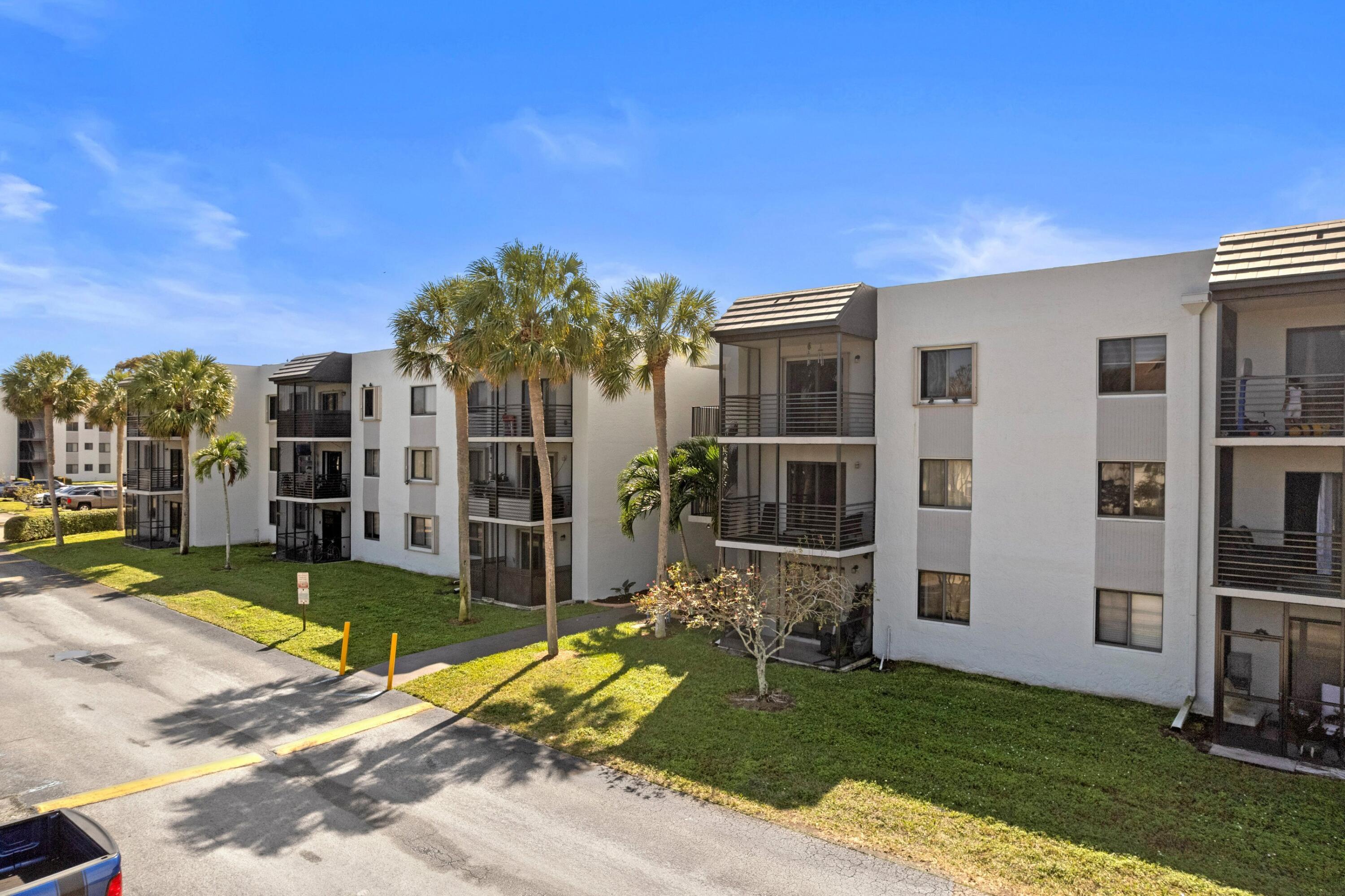 3710 North Pine Island Road, Unit 114 Sunrise, FL 33351 - Photo 22 of 32 a view of a house with backyard porch and sitting area
