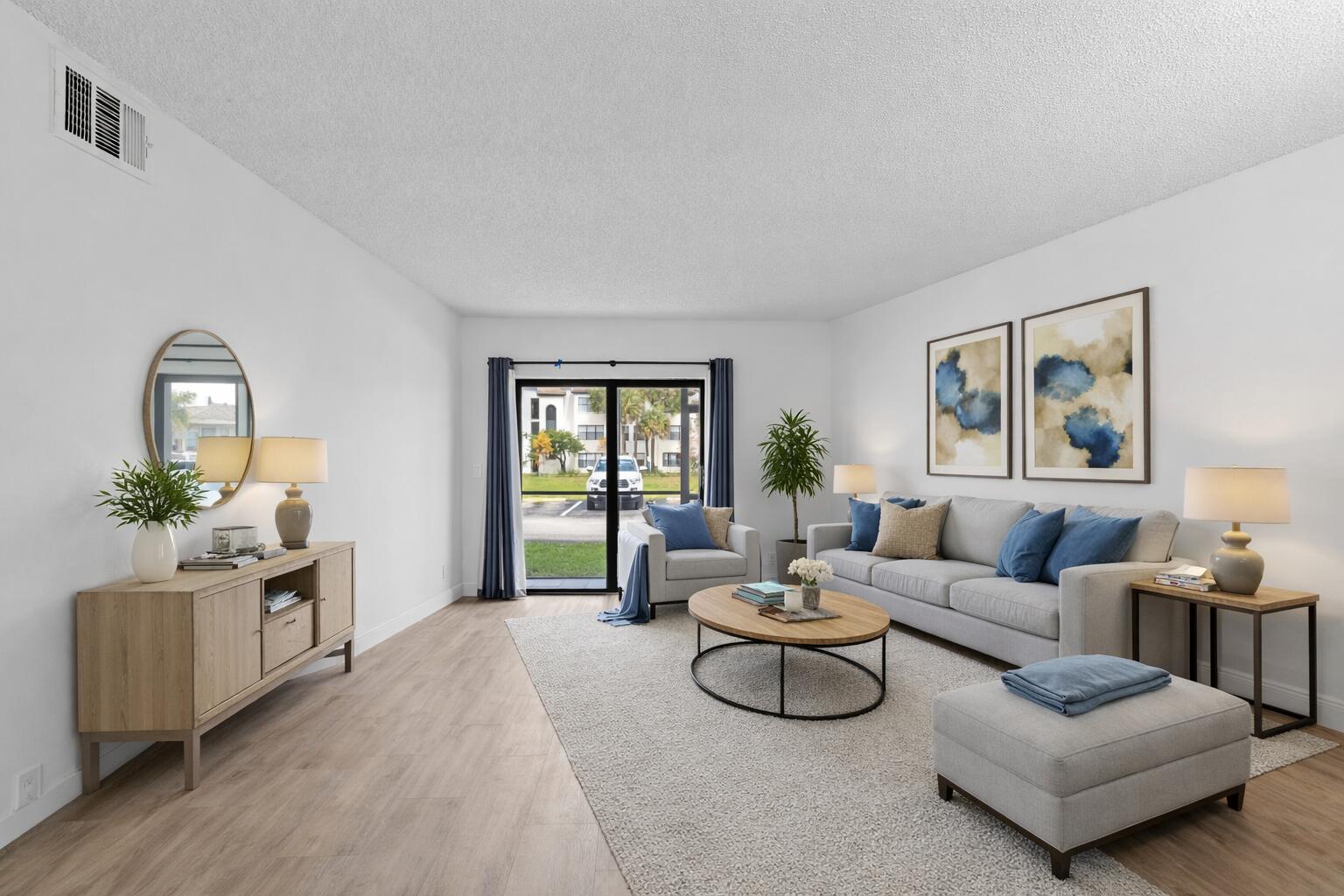 3710 North Pine Island Road, Unit 114 Sunrise, FL 33351 - Photo 4 of 32 a living room with furniture and wooden floor