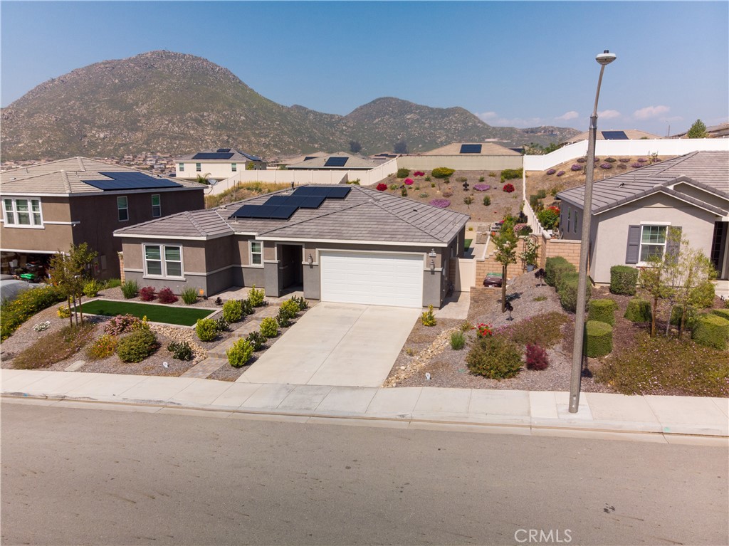 20804 Spring Mountain Road Riverside, CA 92507 - Photo 1 of 1 a front view of a house with a garden