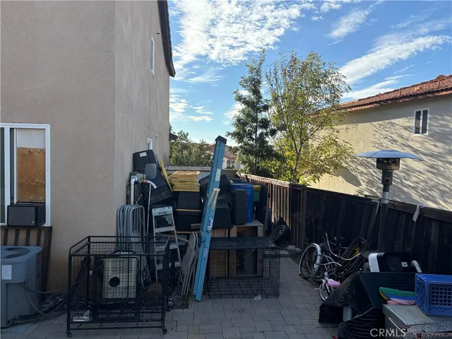 a view of a backyard with sitting area and furniture