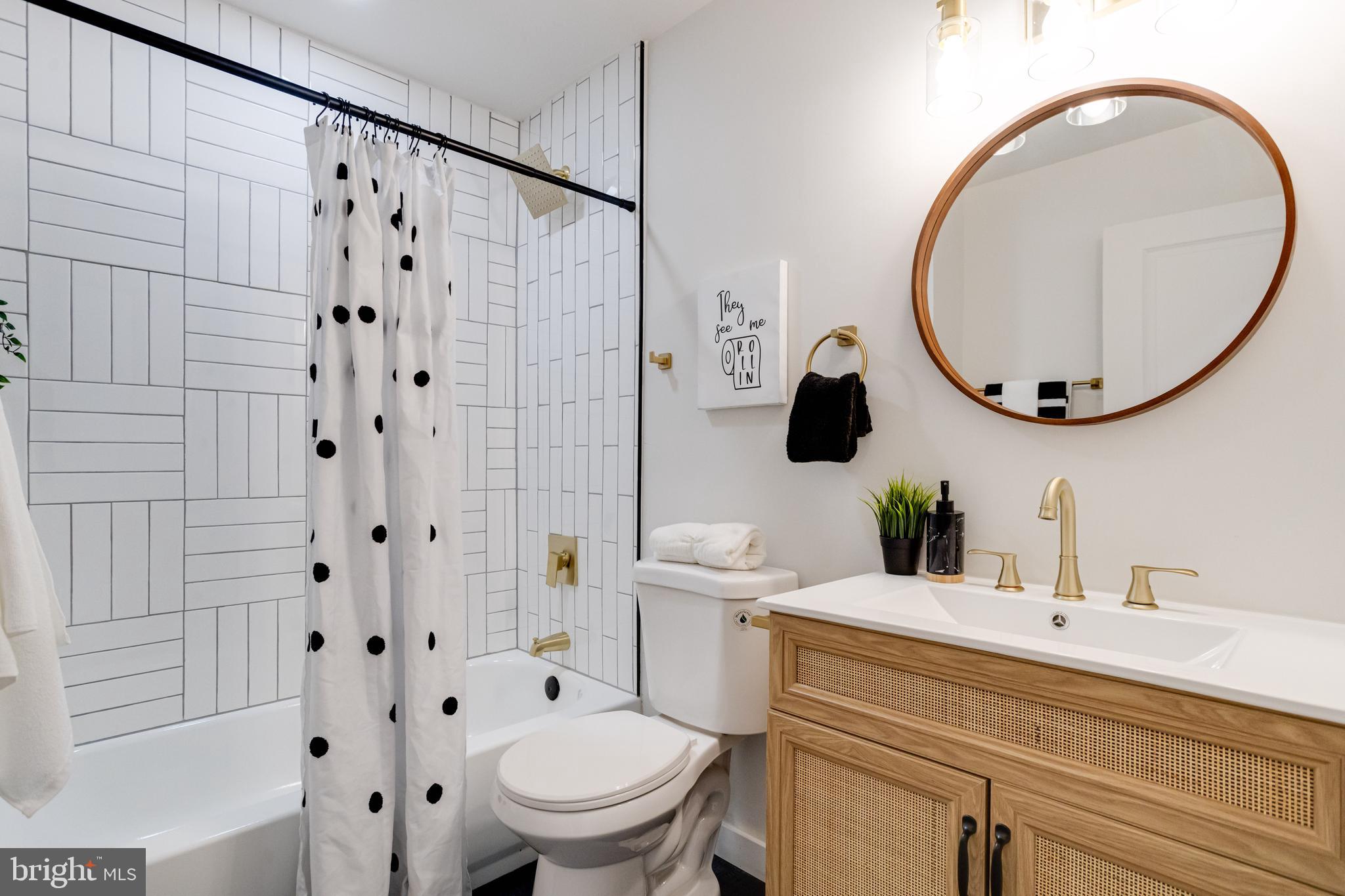 7606 Bagley Avenue Baltimore, MD 21234 - Photo 17 of 45 a bathroom with a sink a toilet and a mirror