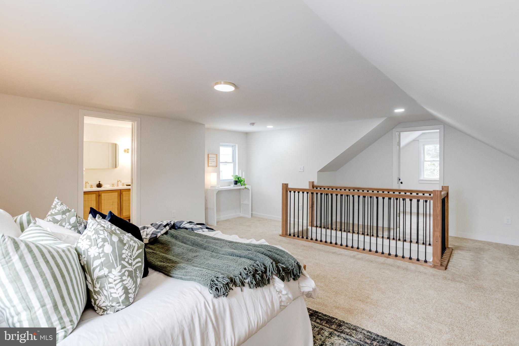 7606 Bagley Avenue Baltimore, MD 21234 - Photo 26 of 45 a bed sitting in a bedroom next to a window