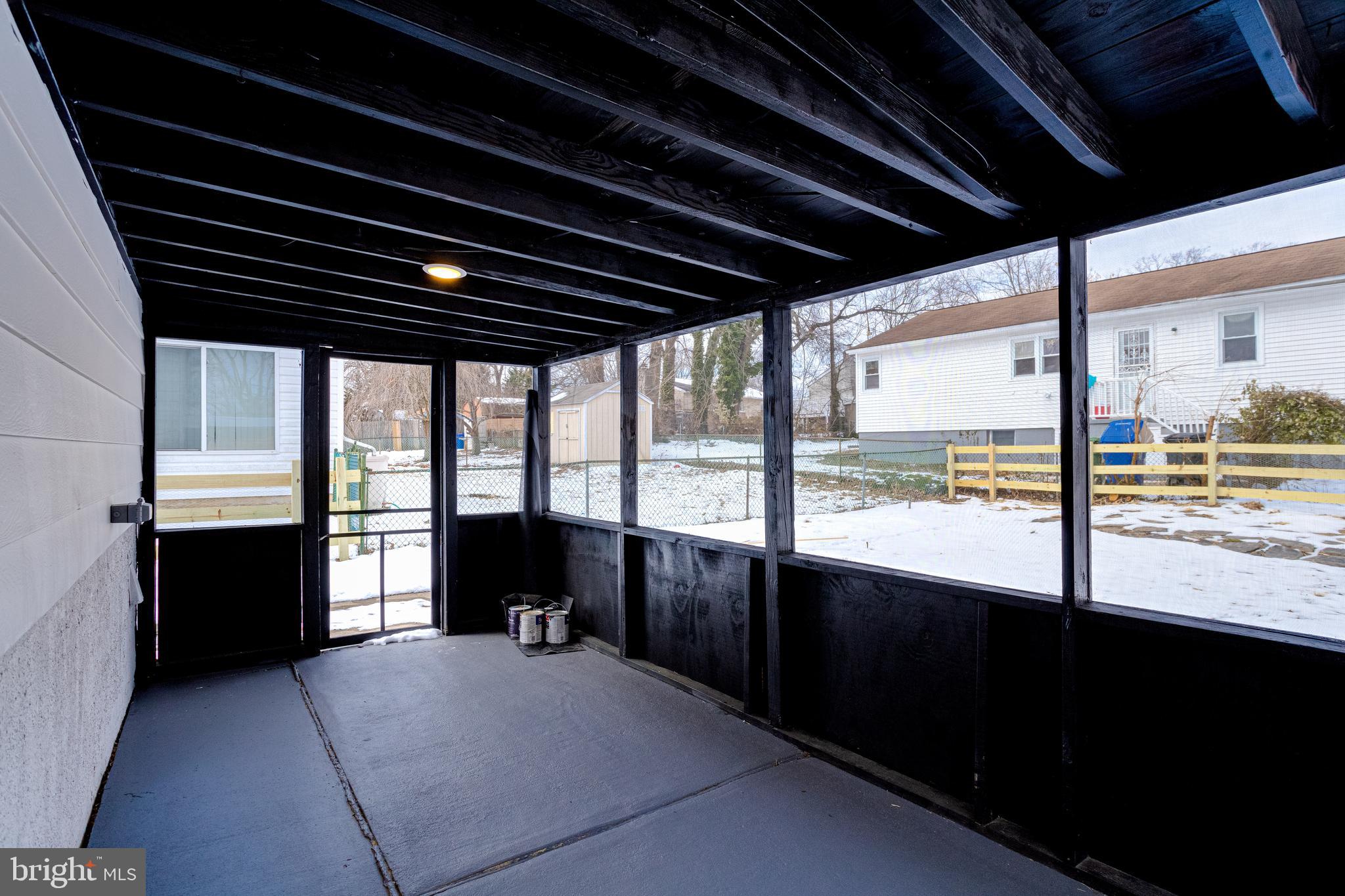 7606 Bagley Avenue Baltimore, MD 21234 - Photo 40 of 45 a view of an empty room with a fireplace