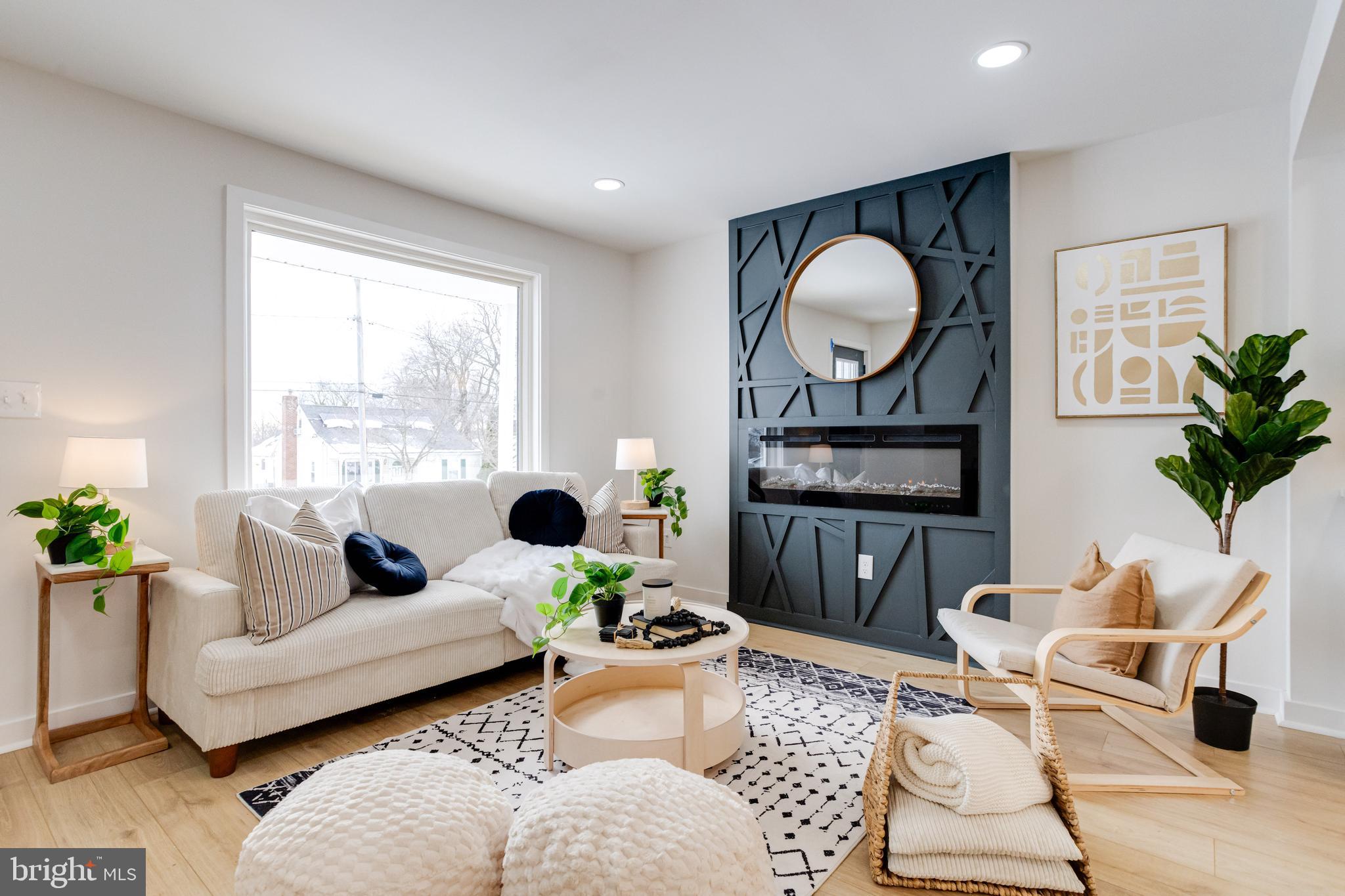 7606 Bagley Avenue Baltimore, MD 21234 - Photo 6 of 45 a living room with furniture and wooden floor