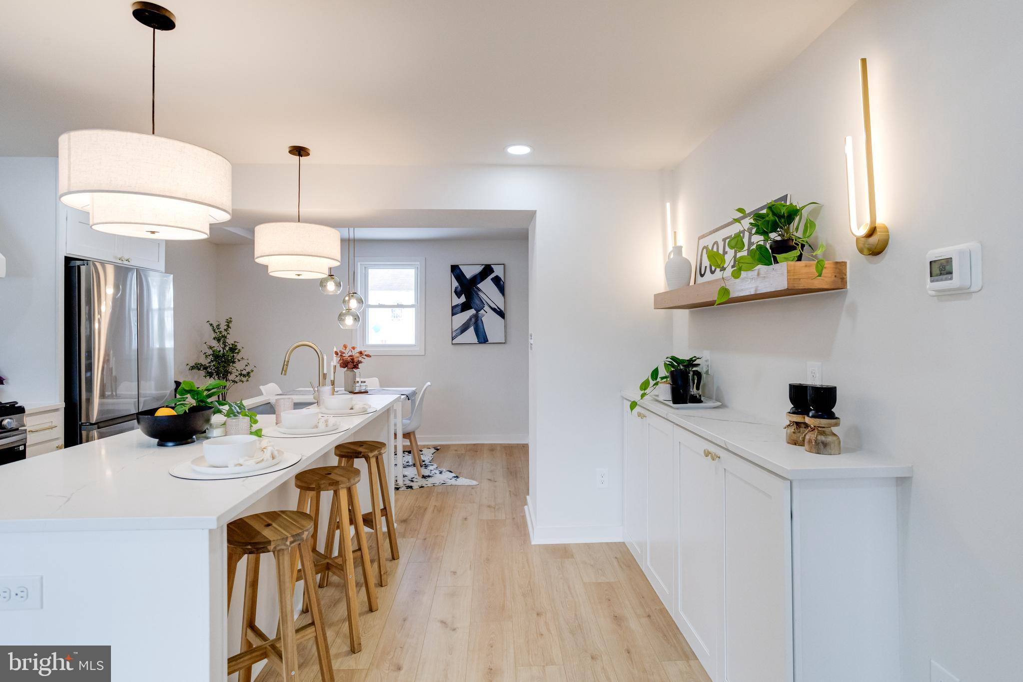 7606 Bagley Avenue Baltimore, MD 21234 - Photo 9 of 45 a view of a kitchen and living room