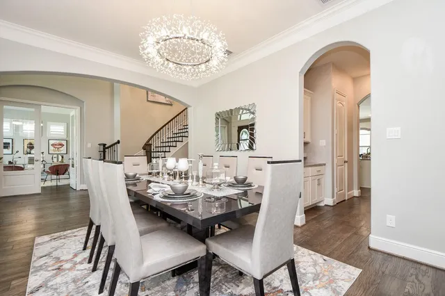 a view of a dining room with furniture and wooden floor