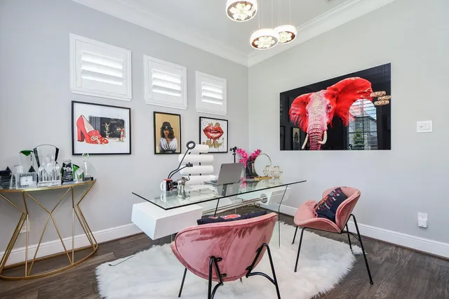 a living room with furniture a rug and a flat screen tv