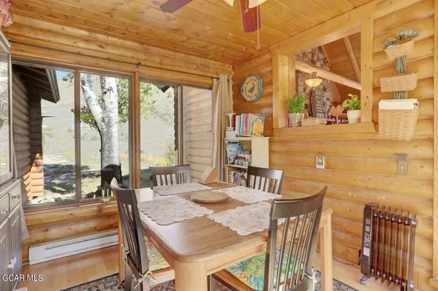 a dining room with large window