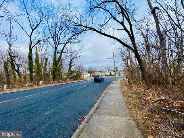 a view of a pathway with a yard