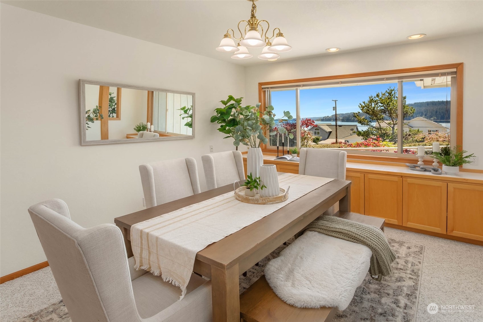6404 Warren Street Anacortes, WA 98221 - Photo 12 of 38 a view of a dining room with furniture window and outside view