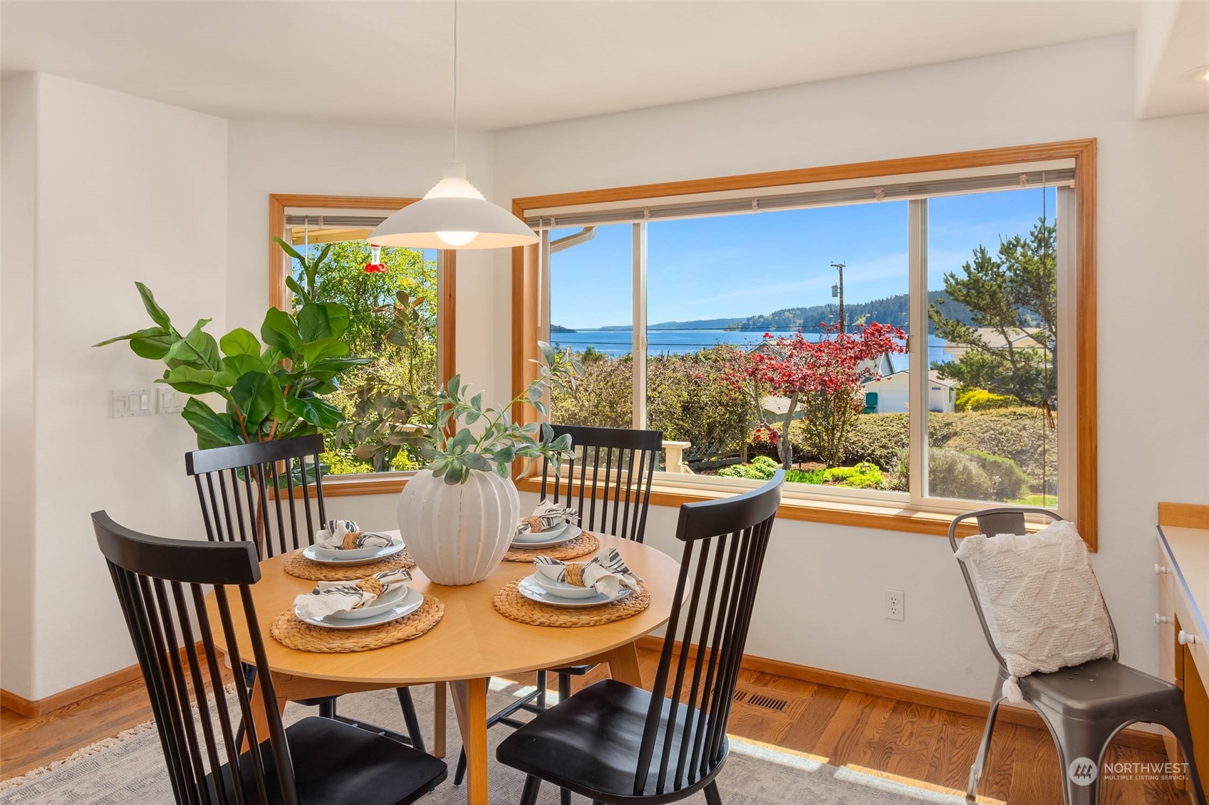 6404 Warren Street Anacortes, WA 98221 - Photo 19 of 38 a view of a dining room with furniture window and outside view