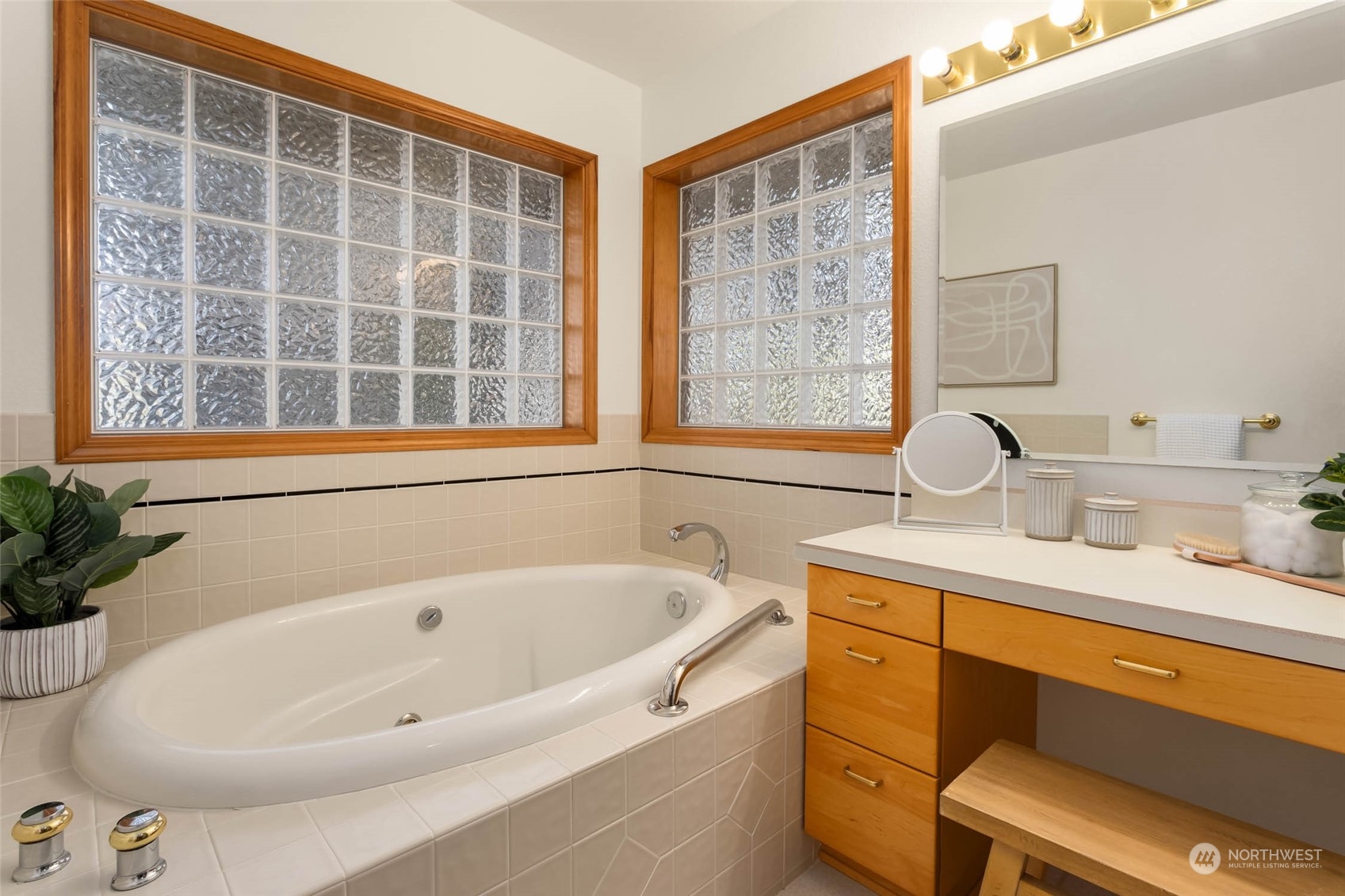 6404 Warren Street Anacortes, WA 98221 - Photo 24 of 38 a bathroom with a tub sink and mirror