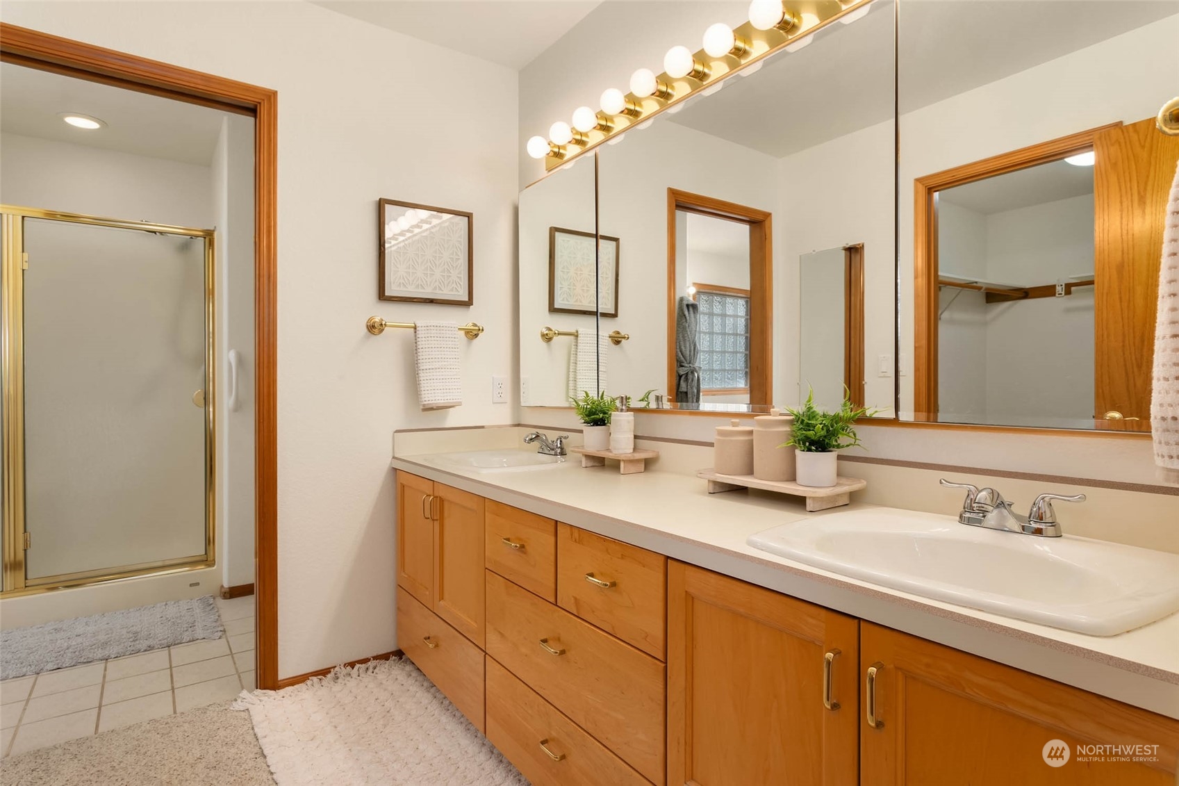 6404 Warren Street Anacortes, WA 98221 - Photo 25 of 38 a bathroom with double vanity sinks and a mirror