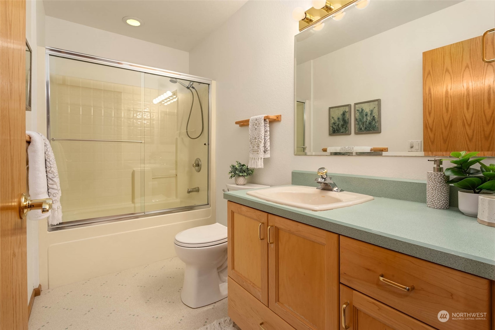6404 Warren Street Anacortes, WA 98221 - Photo 29 of 38 a bathroom with a granite countertop sink toilet and shower