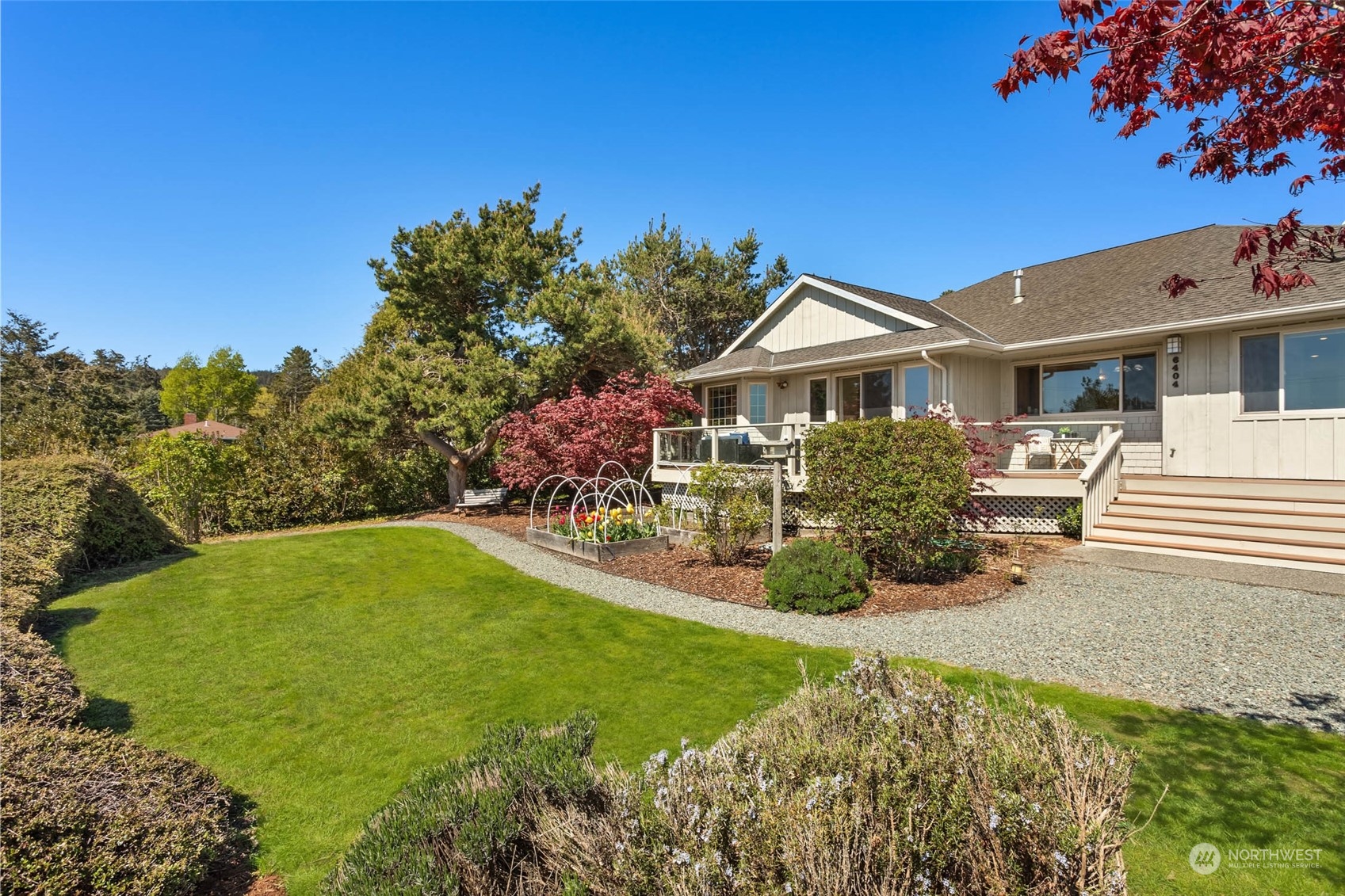 6404 Warren Street Anacortes, WA 98221 - Photo 32 of 38 a front view of a house with a yard
