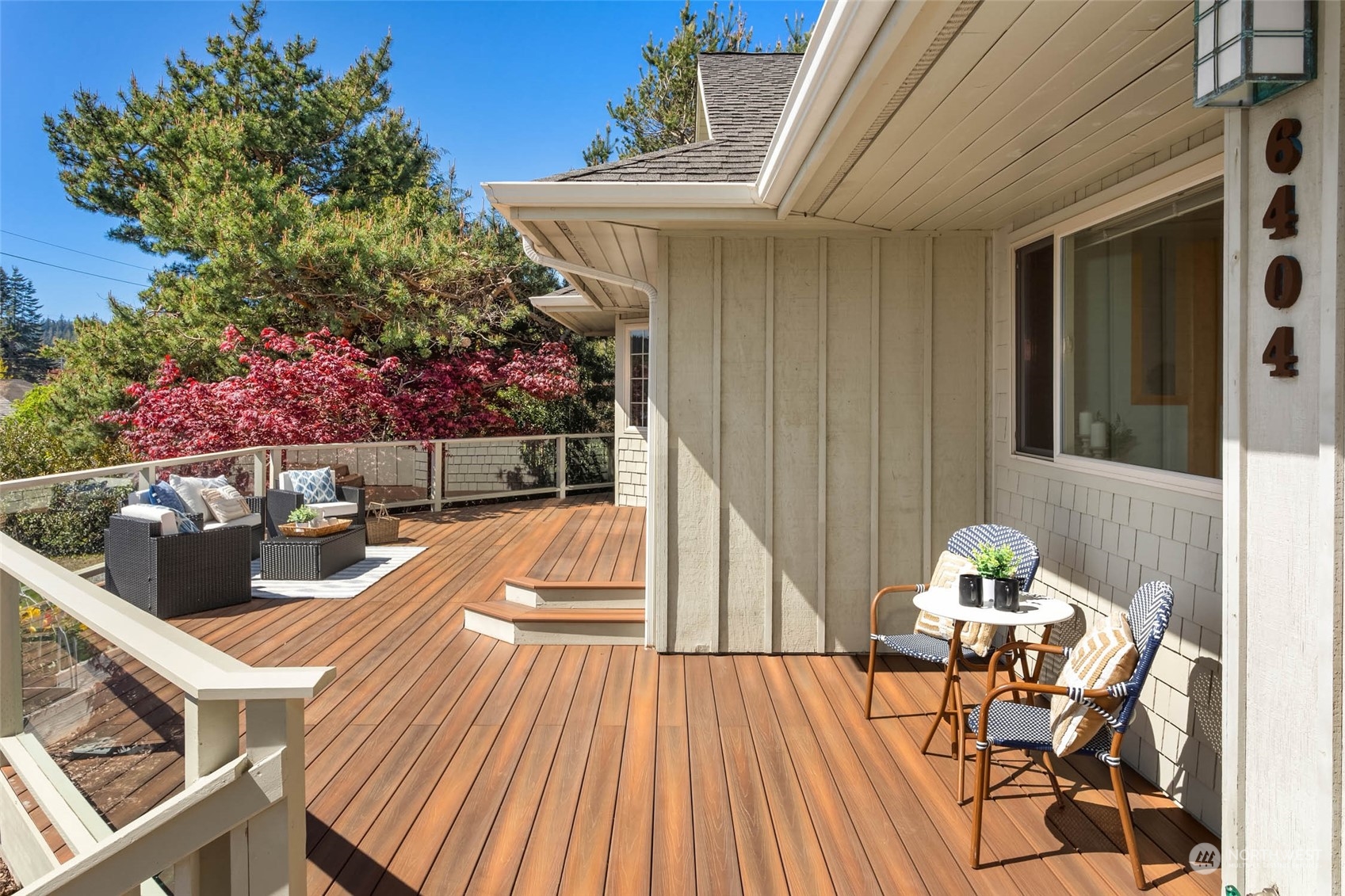 6404 Warren Street Anacortes, WA 98221 - Photo 34 of 38 a view of a patio with table and chairs and potted plants