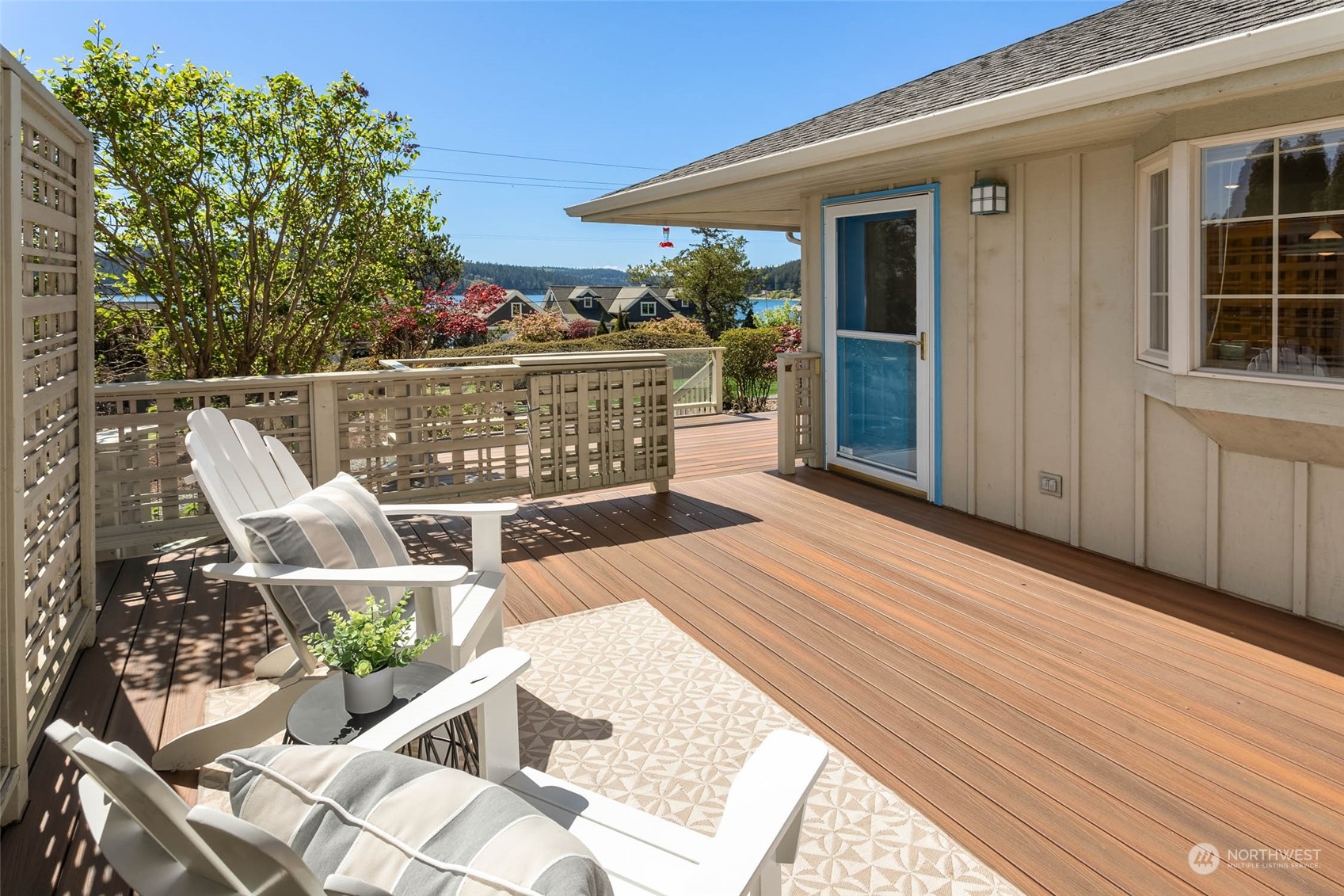 6404 Warren Street Anacortes, WA 98221 - Photo 35 of 38 a view of a balcony with two chairs and a table