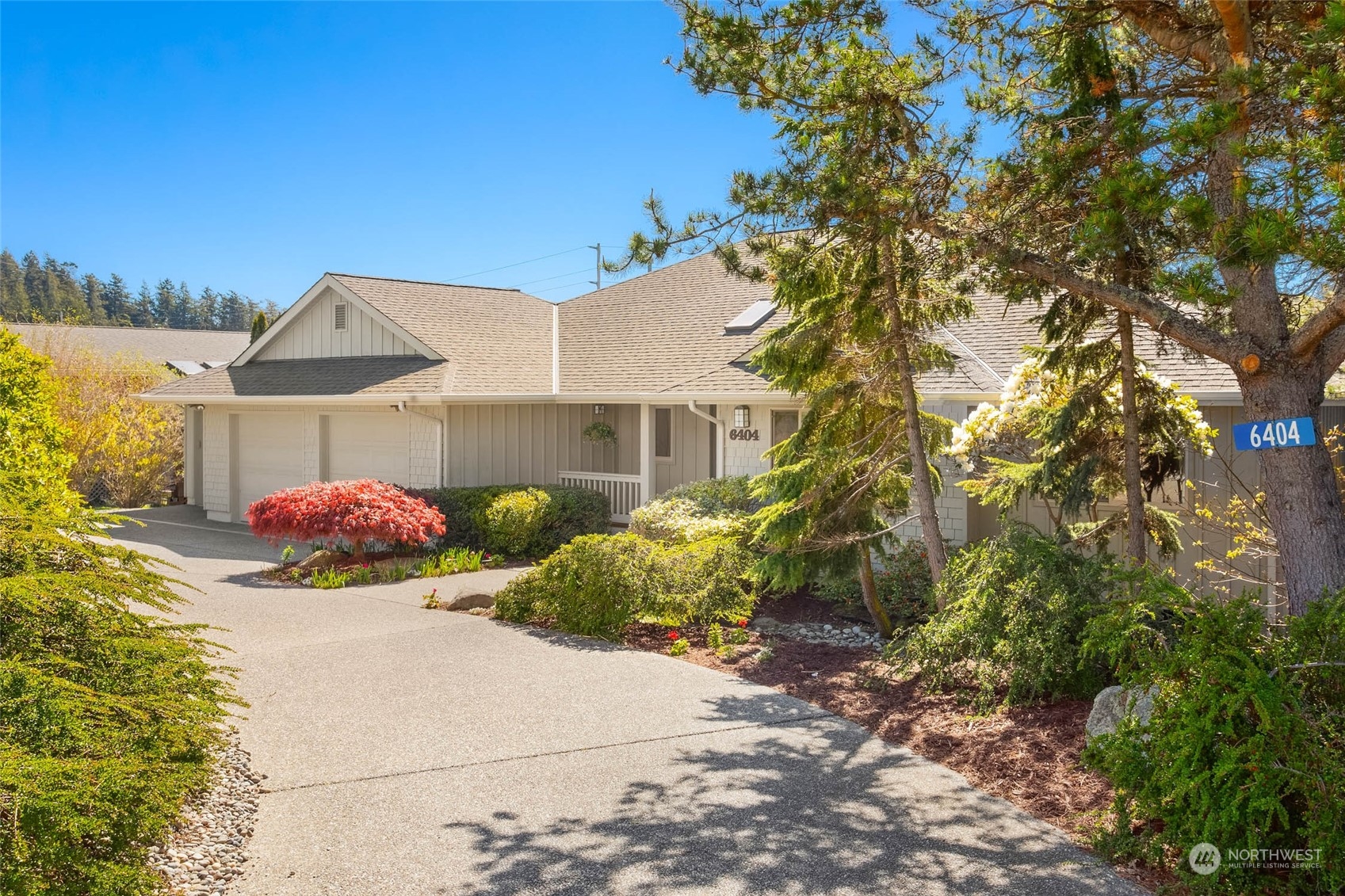 6404 Warren Street Anacortes, WA 98221 - Photo 6 of 38 a front view of a house with a yard