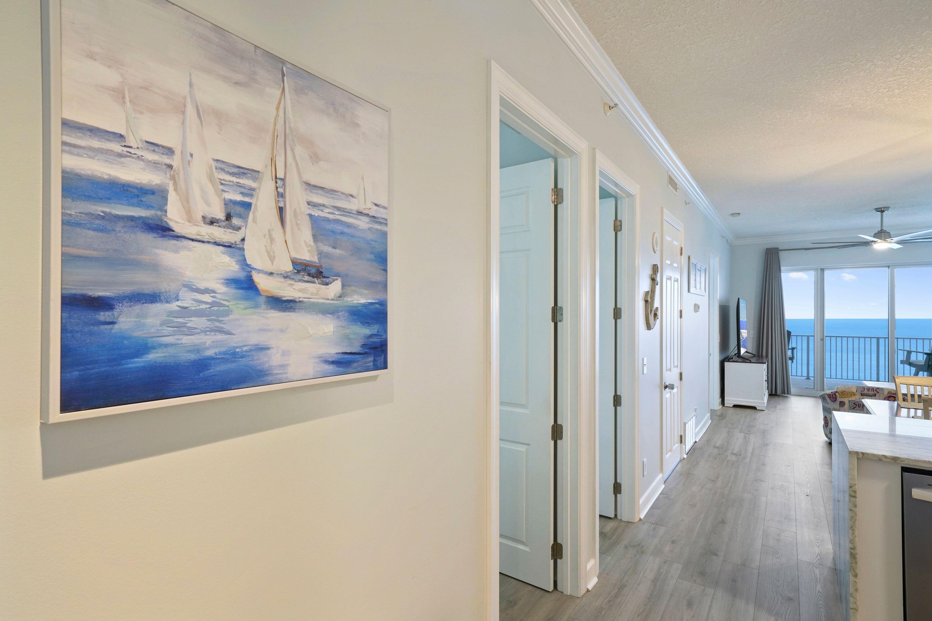 14415 Front Beach Road, Unit 2007 Panama City Beach, FL 32413 - Photo 15 of 26 a view of a hallway with wooden floor windows and a living room