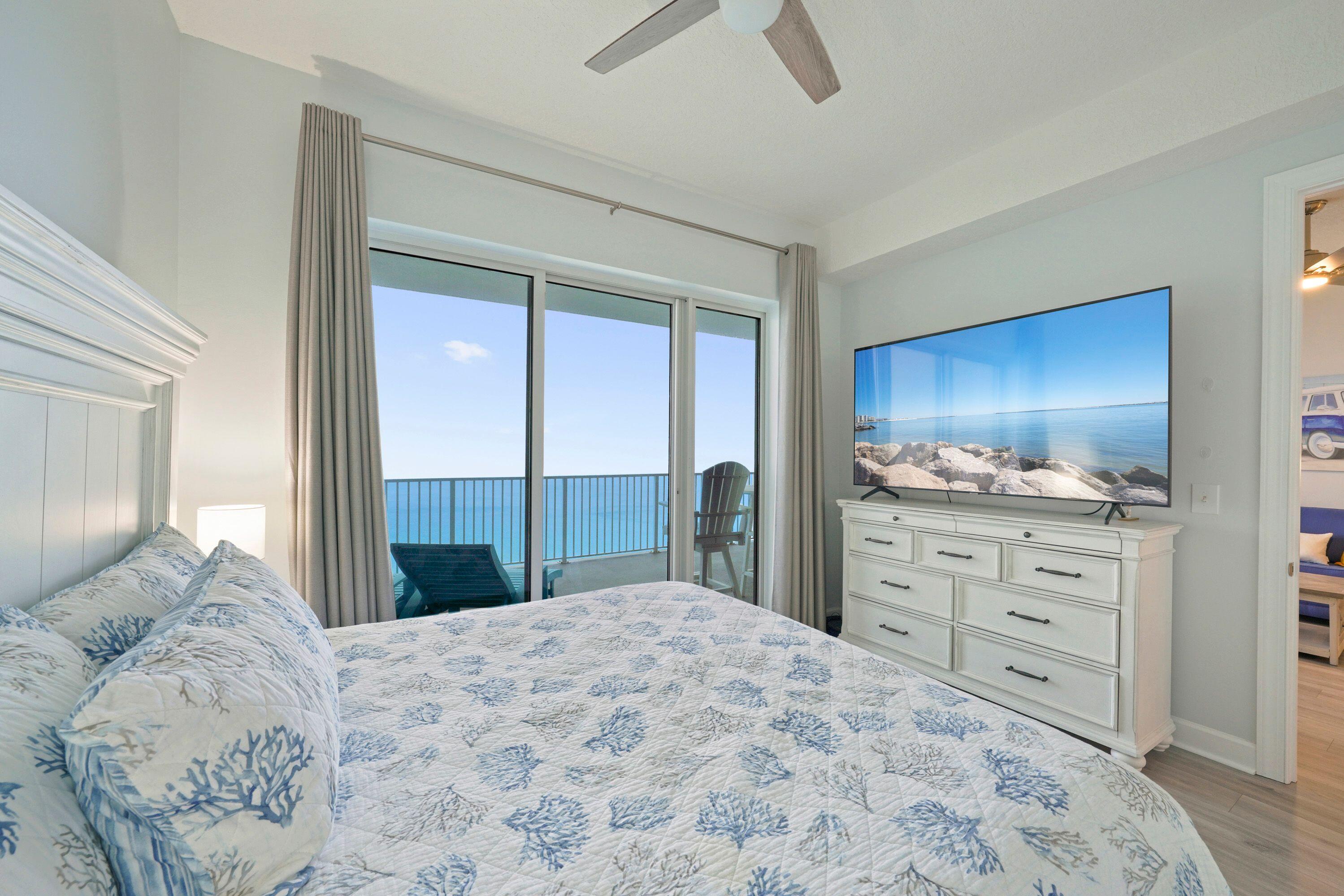 14415 Front Beach Road, Unit 2007 Panama City Beach, FL 32413 - Photo 18 of 26 a bedroom with a bed and a dresser